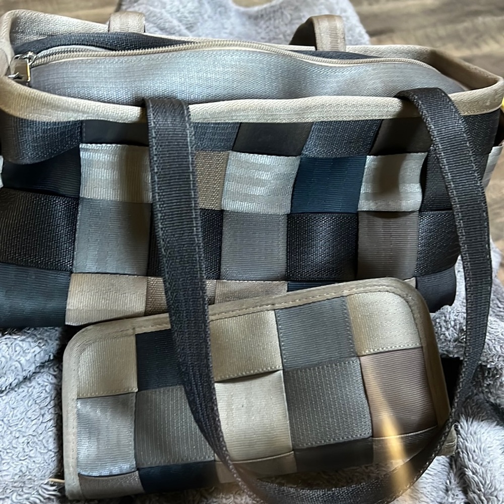 Harvey’s multi color, gray, seatbelt purse and signed autographed Dana wallet